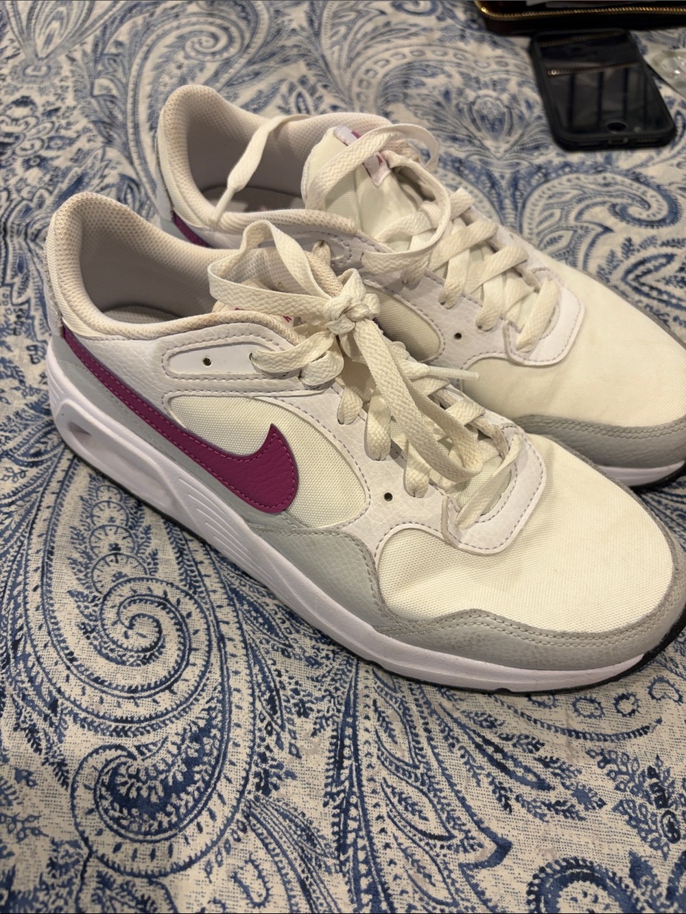 Nike Women’s White Sneakers with Pink Swoosh Accent